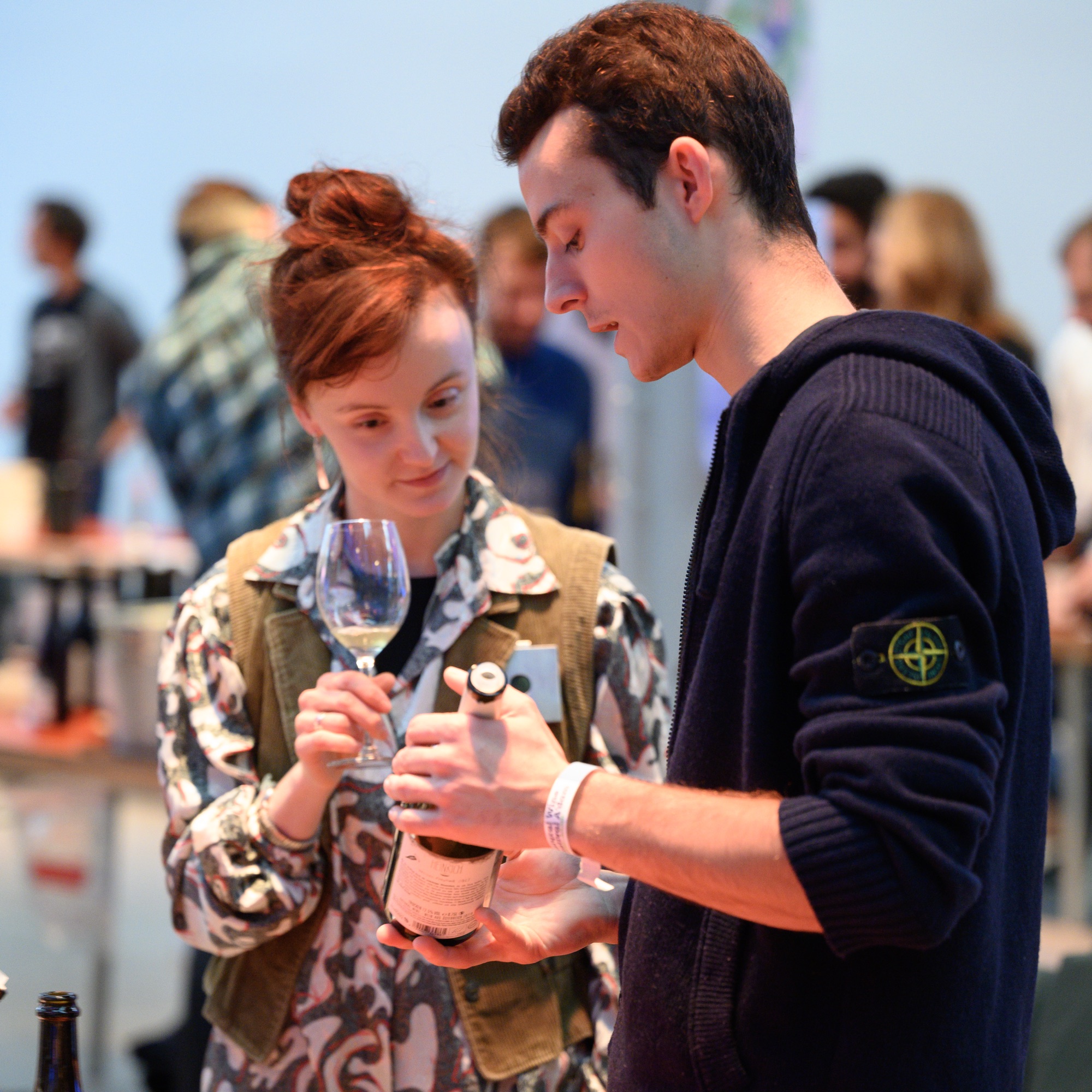 A winemaker pouring at the tasting floor